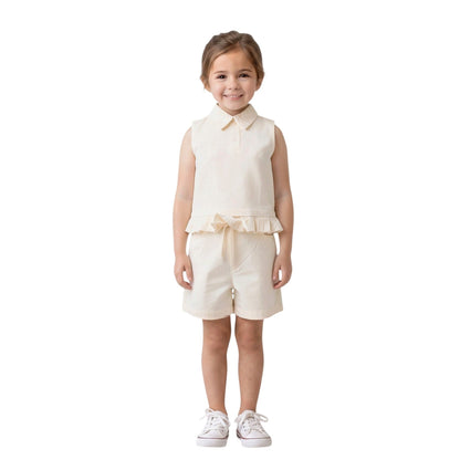 Young girl wearing a cream-colored VanCR BAIKU WANGZI sleeveless collared top and matching shorts cordset